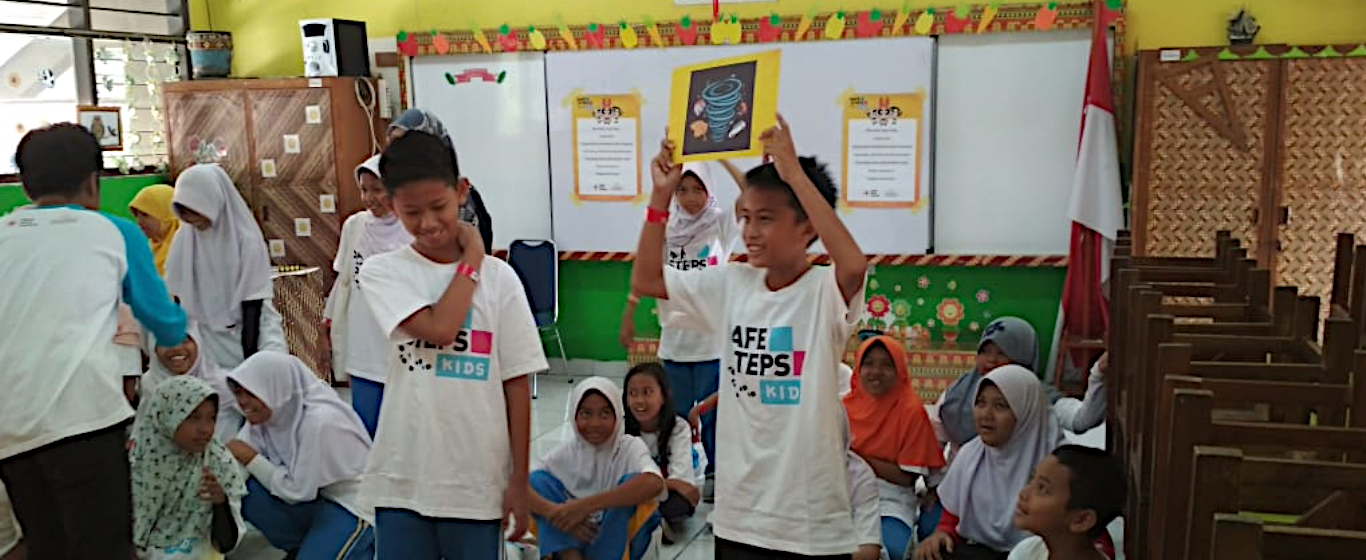 Children learning about natural disasters in class