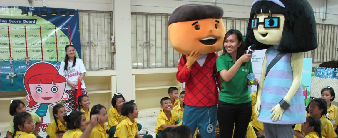 Instructor with two band members teaching children