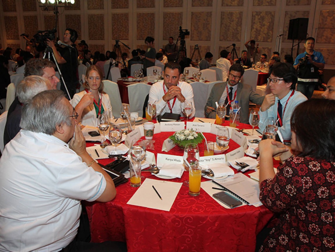 Photo of delegates talking together at a table