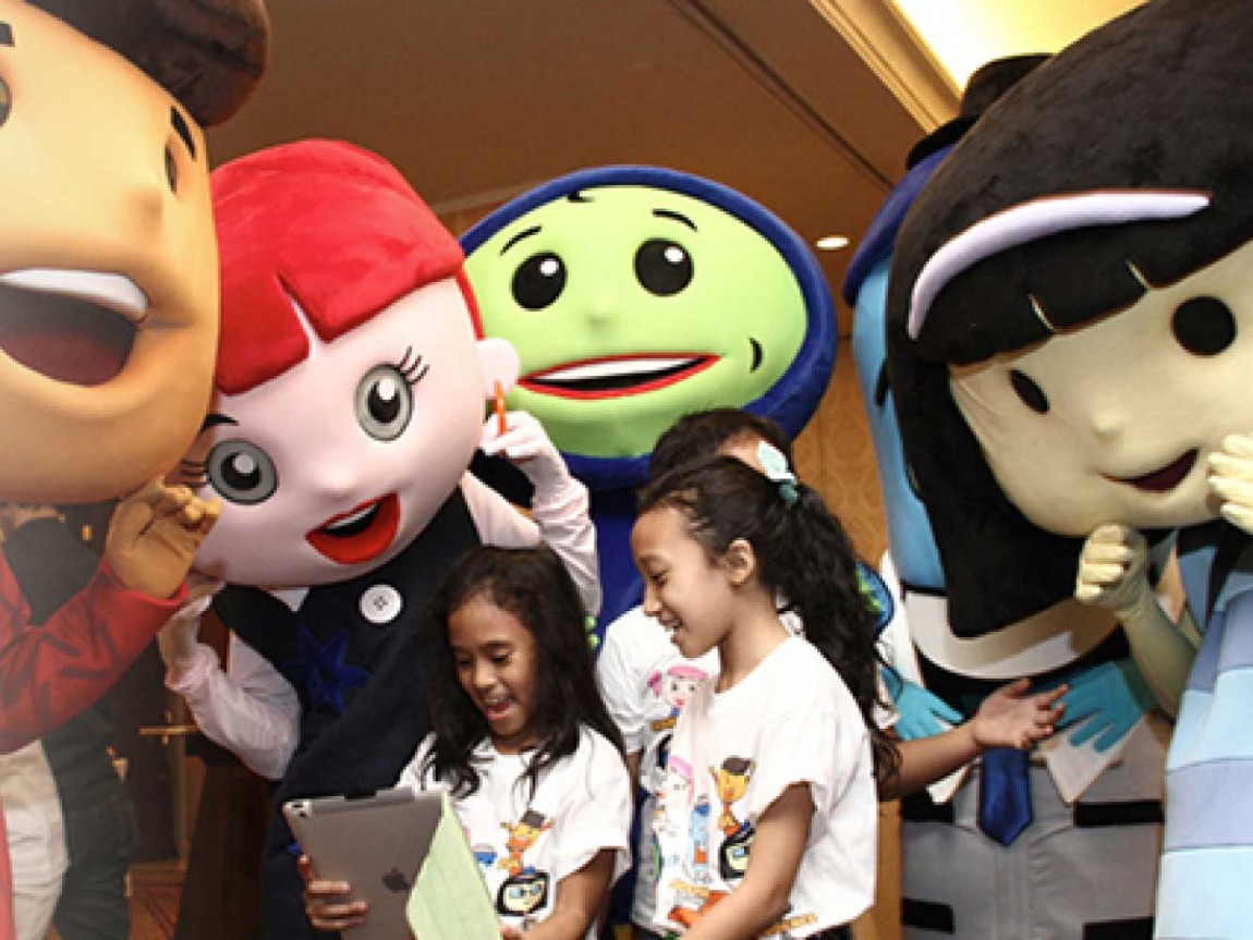 Children reading from tablet